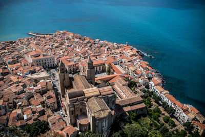 High angle shot of townscape against calm sea