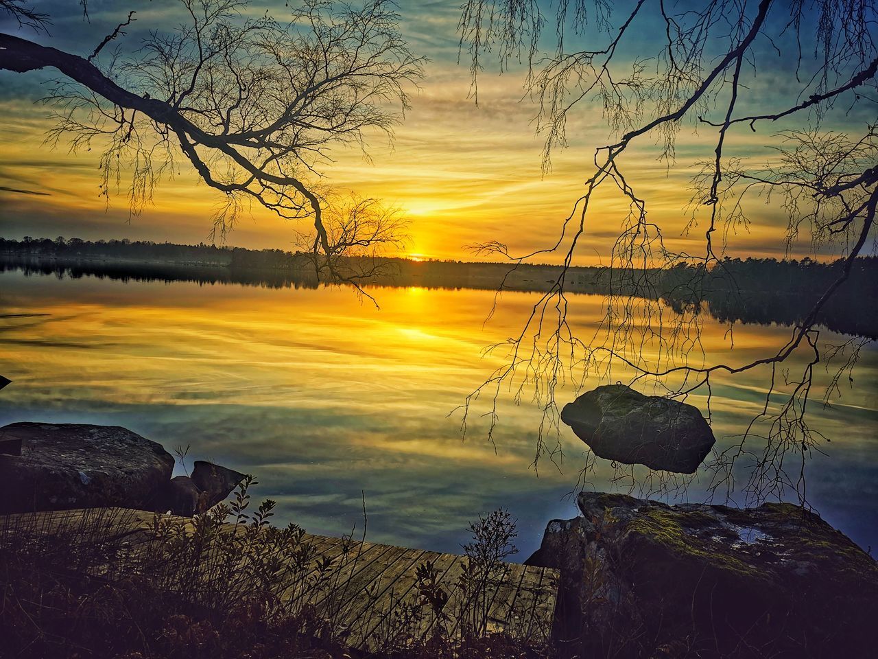 SCENIC VIEW OF LAKE DURING SUNSET