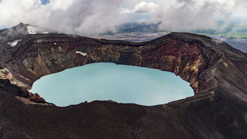 Kamchatka. maly semyachik volcano crater with acid lake