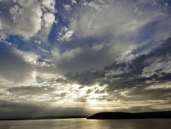 Scenic view of sea against cloudy sky