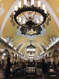 Group of people on ceiling of building