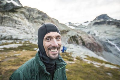 Portrait of smiling man during hiking trip