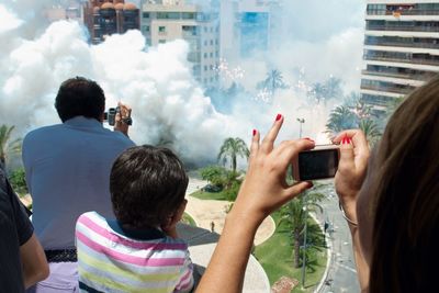 Woman photographing through smart phone