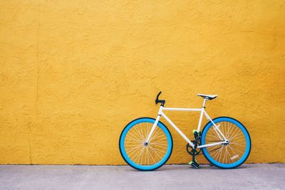 Bicycle parked on wall