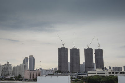 Modern buildings against sky in city