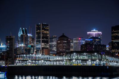 Illuminated buildings in city at night