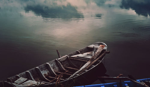 High angle view of man on boat moored in lake