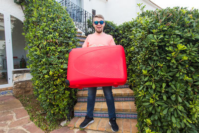 Portrait of man with sunglasses on chair