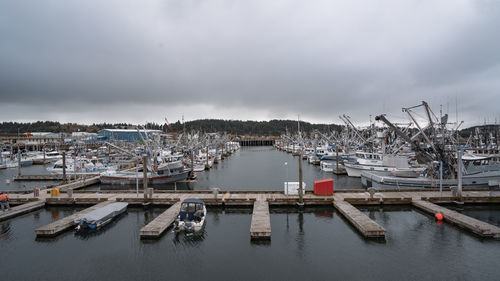 Boats moored at harbor