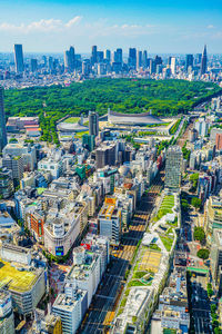 High angle view of modern buildings in city against sky