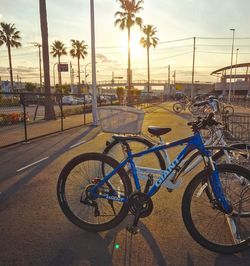 Bicycle by sea against sky