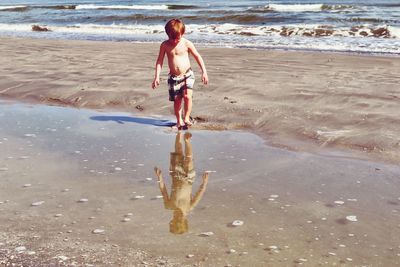 Full length of man walking on beach