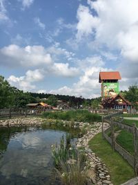 Built structures against cloudy sky