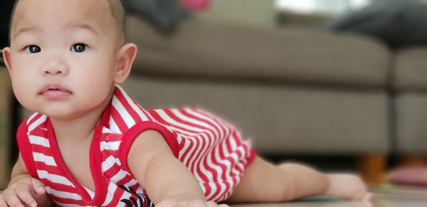 Portrait of boy looking away at home