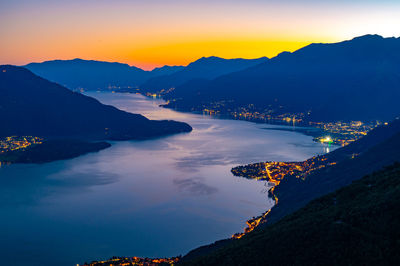 Lake como, photographed by gera lario, in the evening. view of towns and the upper lake mountains.