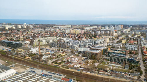 Aerial view from above drone public transport scene in gdansk. oliva star business district