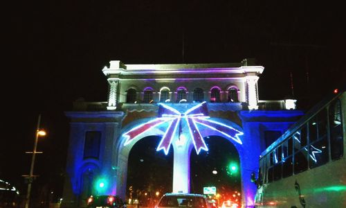 Low angle view of illuminated lights at night