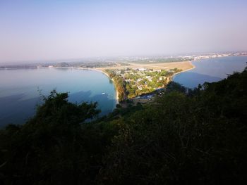 High angle view of trees and sea against sky
