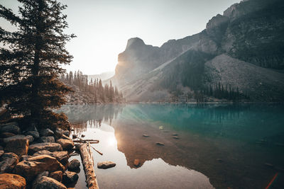 Scenic view of lake and mountains against sky