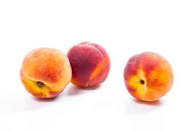 Close-up of apples on white background