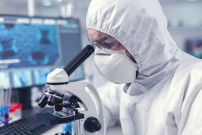 Female doctor examining patient in laboratory