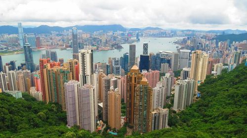 Cityscape against cloudy sky