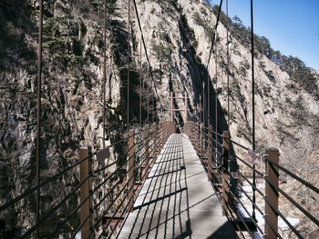 Bridge leading towards mountain