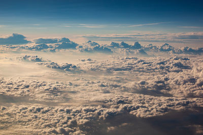Beautiful fluffy clouds from the window of the plane
