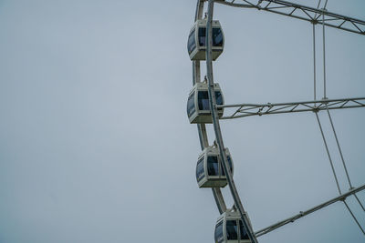 Low angle view of communications tower against sky