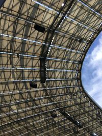 Low angle view of metallic structure against sky