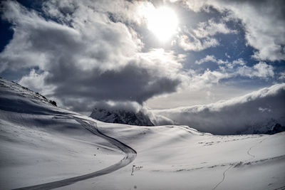 Scenic view of snowcapped mountains against sky