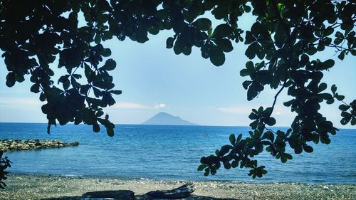 Scenic view of sea against blue sky