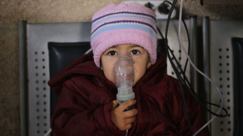 Portrait of girl with nebulizer