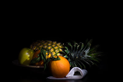 Close-up of fruits against black background