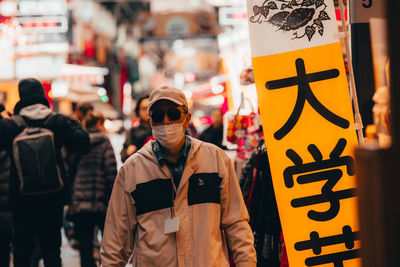 People standing on street in city