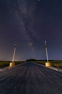 Road against sky at night