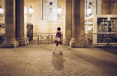 Full length of woman standing in city