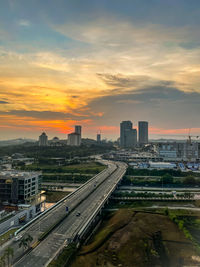 High angle view of buildings against sky during sunset