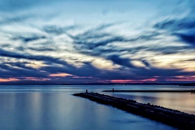 Scenic view of sea against dramatic sky