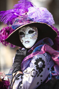 Portrait of woman wearing costume and mask