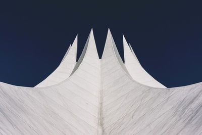 Low angle view of white structure against blue sky