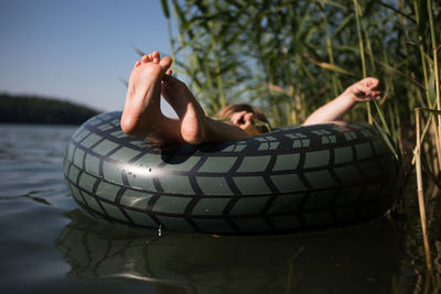 Woman lying down in lake