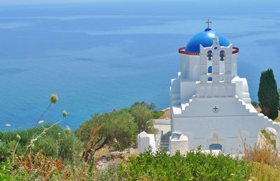 High section of church against calm blue sea