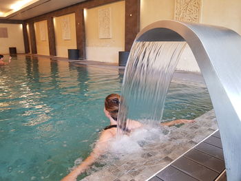 Woman swimming in pool