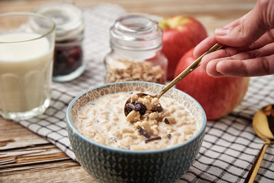 Morning breakfast with granola on wooden background