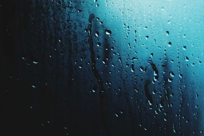 Close-up of water drops on glass