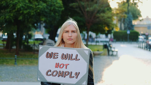 Portrait of a young woman standing outdoors