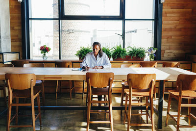 Businesswoman working at conference table