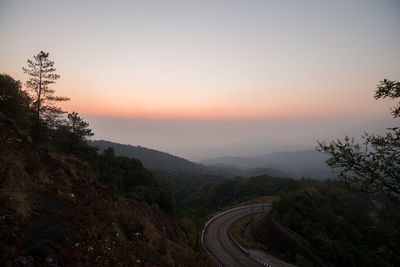 Scenic view of mountains against sky during sunset