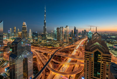 High angle view of illuminated buildings in city